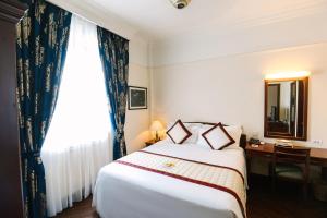 Voodi või voodid majutusasutuse Du Parc Hotel Dalat toas