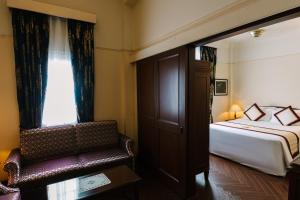 Voodi või voodid majutusasutuse Du Parc Hotel Dalat toas