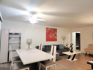 a living room with a table and a couch at Santa Monica Executive Suites in Los Angeles +26 photos