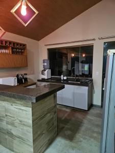 Η κουζίνα ή μικρή κουζίνα στο Refúgio do ipê +9 φωτογραφίες