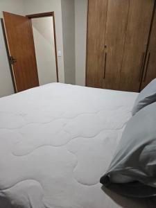 Ένα ή περισσότερα κρεβάτια σε δωμάτιο στο Refúgio do ipê