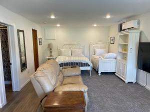 a living room with a couch and a bed at Studio at the Esplanade in Waseca +9 photos