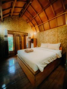 Postel nebo postele na pokoji v ubytování Coffee Homestay Tetebatu