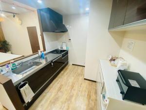 A cozinha ou kitchenette de 時間を忘れる貸別荘オールブルー