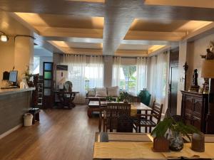 a living room with a table and a dining room at Gabi Villa in San Juan