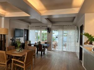 a living room with a dining room table and chairs at Gabi Villa in San Juan +16 photos