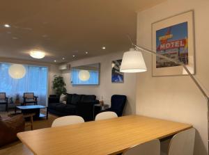 a living room with a table and a couch at Iee Sang House Room 3, 4 queen beds #COEX #Plastic surgery #Hospital #Lotte World #Free parking #Family #Friends in Seoul