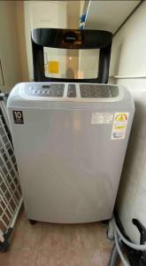 a machine with a microwave on top of it at Iee Sang House Room 3, 4 queen beds #COEX #Plastic surgery #Hospital #Lotte World #Free parking #Family #Friends in Seoul