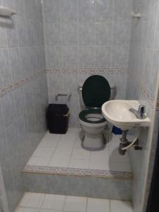 a bathroom with a toilet and a sink at Shantyhostal in Cartagena de Indias +13 photos