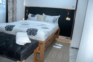 Voodi või voodid majutusasutuse The Escape Nanyuki toas
