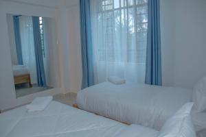 Voodi või voodid majutusasutuse The Escape Nanyuki toas