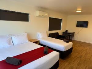 Postel nebo postele na pokoji v ubytování Uni Motel