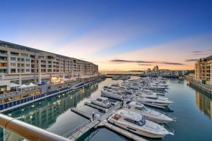 a group of boats are docked in a marina at Sub-Penthouse with Marina View by Host Solutions in Glenelg
