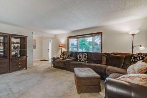 a living room with a couch and a table at 3 BR Minutes Away from Garden of the Gods in Colorado Springs