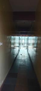an empty hallway in a building with a window at Budget Friendly Rooms in Coorg in Jāmb