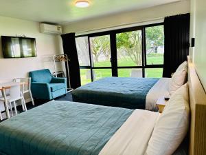 Ein Bett oder Betten in einem Zimmer der Unterkunft Airport Gold Star Motel
