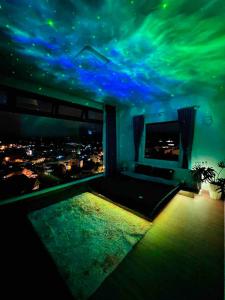 a room with a view of a city at night at Dalat Healing House - Villa Săn Mây Siêu Đỉnh in Da Thanh
