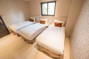 Postel nebo postele na pokoji v ubytování Golden Stone Hotel