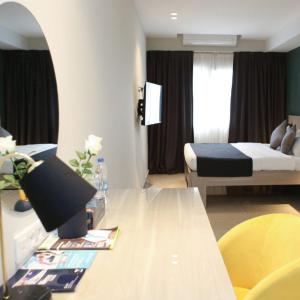 Postel nebo postele na pokoji v ubytování Hôtel Ivotel Abidjan