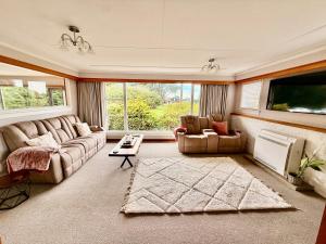 Χώρος καθιστικού στο Comfort & Warmth at Stag Lodge Near Queens Park