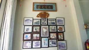 a group of pictures on a wall at Doichang view in Ban Huai Khai