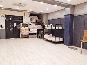 a room with three bunk beds and a room with wooden floors at Okcheon Somakdaegi Pension in Okcheon +76 photos