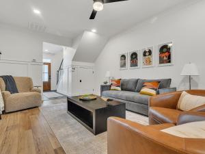 a living room with two couches and a table at Sunset in the Hills condo in Sevierville