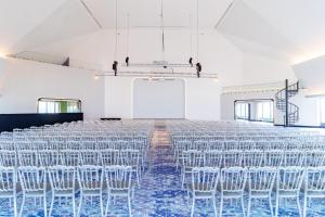an empty room with chairs and a stage at Queensland Hotel Bangkok in Bangkok +56 photos