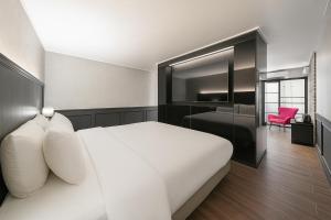 Voodi või voodid majutusasutuse Hotel Lin toas
