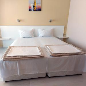 A bed or beds in a room at Exotic Guest House