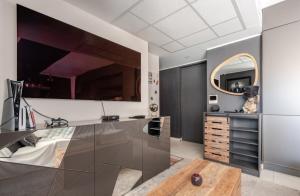 a bedroom with a large mirror and a dresser at Casa de Marseille in Marseille +25 photos
