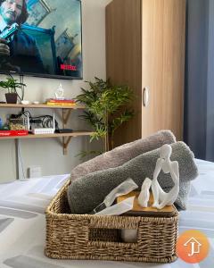 a basket with two dolls sitting on top of a couch at Studio With Balcony Near Beaches in Mactan in Lapu Lapu City