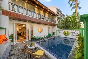 an image of a house with a swimming pool at Greenfield Village Home in Hoi An