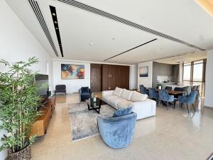 a living room with a couch and a table at WealthyStays 360 Luxury Residence in Nicosia