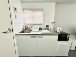 Kuchyň nebo kuchyňský kout v ubytování Neighbor's Hotel 西十日市 + 25 fotografií