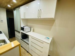 Cucina o angolo cottura di 時間を忘れる貸別荘サウスブルー