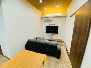 TV o dispositivi per l'intrattenimento presso 時間を忘れる貸別荘サウスブルー