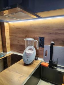 a blender sitting on a counter in a kitchen at Апартамент 8 in Varna City