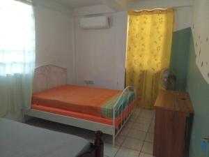 Ένα ή περισσότερα κρεβάτια σε δωμάτιο στο Ti Kay Solèy