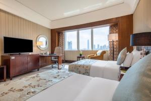 TV a/nebo společenská místnost v ubytování Wuhan Jin Jiang International Hotel
