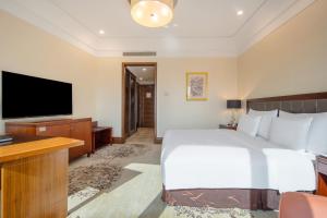 TV a/nebo společenská místnost v ubytování Wuhan Jin Jiang International Hotel