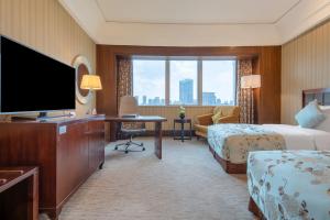 TV a/nebo společenská místnost v ubytování Wuhan Jin Jiang International Hotel