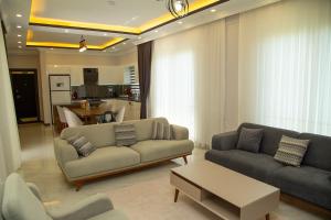 A seating area at Villa with Private Pool and Jacuzzi 2