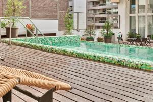 Бассейн в Esplendor by Wyndham Savoy Rosario или поблизости