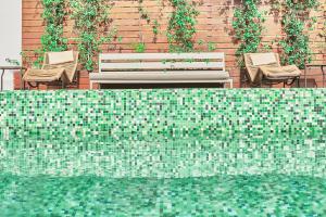 Бассейн в Esplendor by Wyndham Savoy Rosario или поблизости