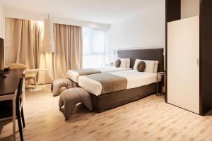 Кровать или кровати в номере Esplendor by Wyndham Savoy Rosario
