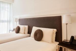 Кровать или кровати в номере Esplendor by Wyndham Savoy Rosario