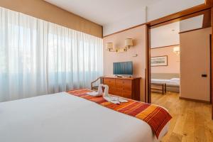 TV a/nebo společenská místnost v ubytování Crystal Hotel Varese