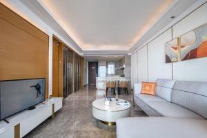TV a/nebo společenská místnost v ubytování Sanya Haitang Bay Genting Seaview Sky Hotel