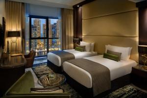 Postel nebo postele na pokoji v ubytování Millennium Place Dubai Marina + 29 fotografií